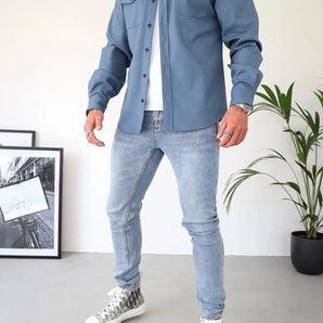 Men's blue workwear utility jacket in size 3XL, shown on a model wearing jeans and a dress shirt, emphasizing its durable, stylish, and versatile design.