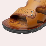 Men's brown leather sandals featuring a comfortable, breathable design with adjustable straps, suitable for outdoor wear.