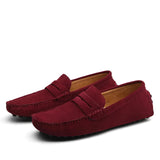 Men's brown suede slip-on loafers featuring a luxury driving moccasin design, showcasing a blend of casual and dress shoe style with a focus on comfort and fashion.
