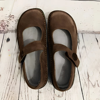 Men's brown suede slippers with an adjustable strap and non-slip synthetic rubber sole, designed for comfort and durability.