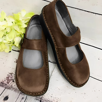 Men's brown suede slippers with an adjustable strap, featuring a non-slip sole, shown in size 43.