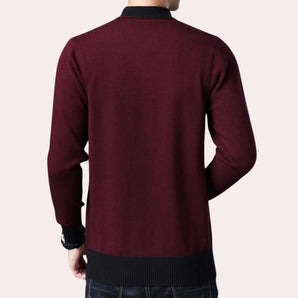 Men's burgundy knit sweater with long sleeves and a round collar, suitable for winter wear.
