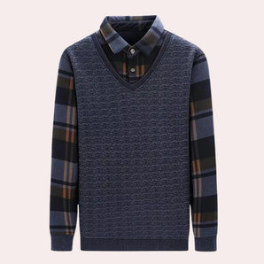 Men's casual knit sweater with a plaid pattern on the collar and V-neck, featuring shades of grey, electric blue, and magenta.