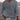 Men's casual white lightweight v-neck knit sweater worn by a bearded man.
