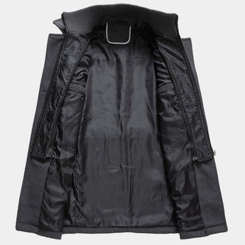 Men's charcoal grey wool blend tailored winter overcoat with long sleeves, a structured collar, and front pockets.
