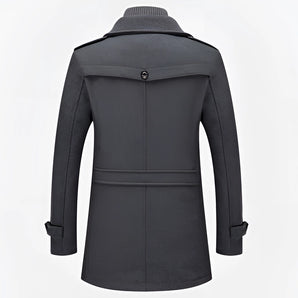 Men's charcoal grey wool blend tailored winter overcoat with long sleeves, a structured collar, and a formal design.