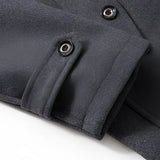 Men's charcoal wool slim fit overcoat in military style with long sleeves, a grey tint, a structured collar, and button detailing.