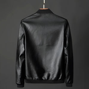 Men's classic black glossy leather jacket displayed on a clothes hanger, featuring a sleek design with a collar and long sleeves, ideal for luxury outerwear and formal wear occasions.