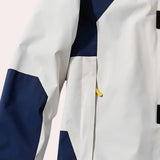 Men's color-block hooded windbreaker jacket featuring a lightweight design with grey and electric blue accents, long sleeves, and a collar, ideal for sportswear or casual outings.