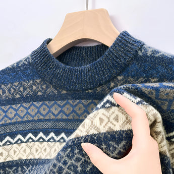 Men's blue woolen sweater featuring a Fair Isle pattern, with long sleeves and a ribbed collar. The sweater has a cozy and warm design suitable for winter wear.