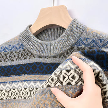 Men's cozy blue Fair Isle woolen sweater featuring intricate patterns in shades of blue and grey, with long sleeves and a classic crew neck design, ideal for winter wear.