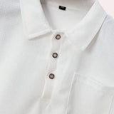 Men's designer white polo shirt with short sleeves and a classic collar, featuring a lightweight and breathable fabric suitable for formal or casual occasions.