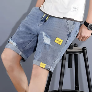 Men's Distressed Cuffed Denim Shorts in Light Wash, Blue, 5XL, modeled with a white dress shirt.