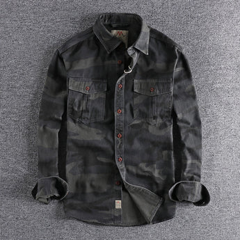 Men's durable military camo style jacket featuring a grey camouflage pattern, button closure, and a collared design with long sleeves, resembling a tactical uniform or blazer style.