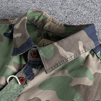 Men's military camo style jacket featuring a camouflage pattern in shades of grey, khaki, and beige with long sleeves and a collar, designed for tactical outerwear.