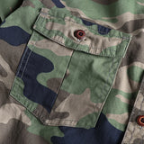 Men's durable military-style camouflage jacket featuring a mix of brown, grey, and beige tones, with long sleeves and tactical outerwear design.