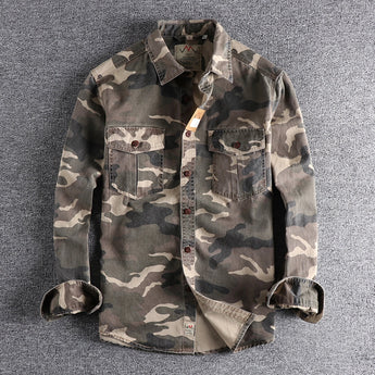 Men's military-style camouflage jacket with long sleeves, featuring a durable design suitable for tactical use. The jacket showcases a classic collar and a distinctive camo pattern, blending fashion design with the practical aesthetics of a uniform.