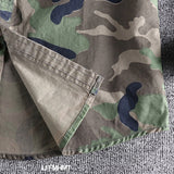 Men's military-style camo jacket featuring a grey camouflage pattern with long sleeves, designed for durability and tactical use.