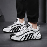 Men's fashionable futuristic design sneakers in a grey color with urban athletic styling, featuring a unique and modern look suitable for sportswear and outdoor activities.