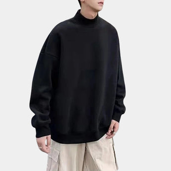 Men's black casual cotton-blend turtleneck sweater with long sleeves and a pocket, displayed on a mannequin, highlighting the comfortable fit and detailed collar design.