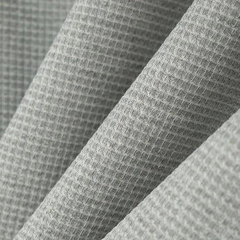 Men's gray slim fit blazer displayed on a plain background, showcasing its casual lightweight design and urban style with a patterned texture in shades of grey.