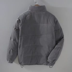 Men's grey corduroy insulated winter jacket featuring a high collar, urban style design with long sleeves and multiple pockets.