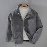 Men's grey corduroy insulated winter jacket with high collar, long sleeves, and front pockets, designed for an urban style in a 3XL size.