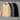 Men's grey corduroy insulated winter jacket featuring a high collar and urban style design, showcasing a blend of natural and composite materials with a fashionable look.
