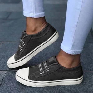 Men's grey casual sneakers with a slip-on design and hook & loop closure, shown in black color variant, size 43.