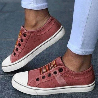 Men's grey lightweight slip-on casual sneakers with a hook and loop closure, featuring a red accent and designed for walking.