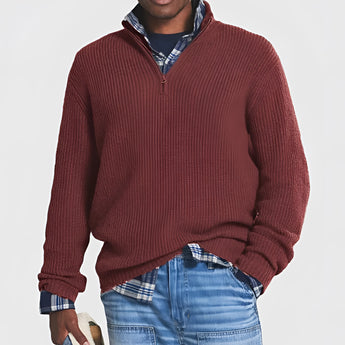 Men's grey ribbed half-zip sweater featuring a high neck and long sleeves, displayed against a neutral background, ideal for fall and winter fashion.