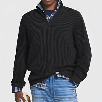 Men's grey ribbed half-zip sweater displayed on a mannequin with black dress shirt underneath, showcasing the neckline and long sleeves, suitable for fall and winter wear.
