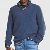 Men's grey ribbed half-zip sweater with a high neck and long sleeves, displayed on a mannequin, suitable for fall and winter wear.