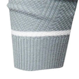 Men's grey ribbed knit striped crew neck sweater worn by a model, showcasing winter fashion. The sweater features a textured pattern and a classic crew neck design, ideal for cold weather.