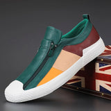 Men's grey slip-on sneakers featuring red accents, designed for style and comfort, displayed in a size 44 with a hint of green, suitable for walking and outdoor activities.