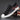 Men's grey slip-on sneakers with red accents, featuring a sleek design, athletic sole, and comfortable fit, ideal for outdoor activities and casual wear.