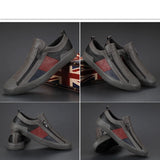 Men's grey slip-on sneakers with red accents, featuring a sleek design and comfortable fit, suitable for walking and outdoor activities.