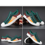 Men's grey slip-on sneakers with red accents featuring a stylish design, perfect for casual wear.