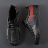 Men's grey slip-on sneakers with red accents, featuring a sporty and stylish design ideal for walking and outdoor activities.