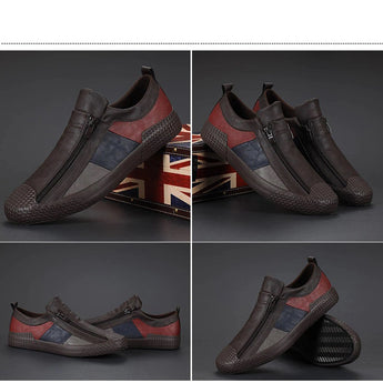 Men's grey slip-on sneakers featuring red accents, photographed against a plain background, showcasing their stylish and comfortable design.