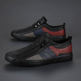 Men's grey slip-on sneakers with red accents designed for style and comfort, featuring a sporty and athletic appearance, suitable for outdoor activities.