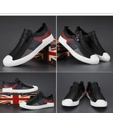 Men's grey slip-on sneakers with red accents, displaying a stylish and comfortable design against a light background.