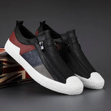 Men's grey slip-on sneakers with red accents, designed for athletic use and outdoor activities, featuring a comfortable and stylish fit ideal for walking, running, or cross-training.