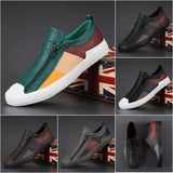 Men's grey slip-on sneakers with red accents, featuring a stylish and comfortable design ideal for fashion-forward walking.