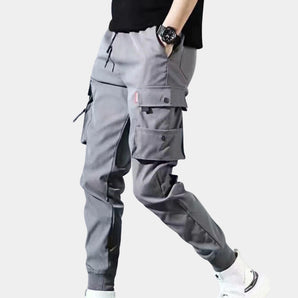 Men's grey tactical cargo pants in size 3XL, featuring a durable design with multiple pockets, adjustable waist, and knee sections, suitable for workwear and active use.