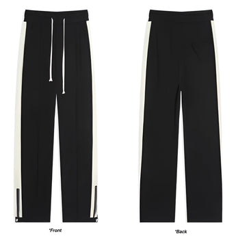 Men's grey tapered joggers featuring two-tone stripes on the sides, with pockets and ankle cuffs.