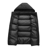 Men's hooded insulated puffer vest with zipper pockets, showcased in a stylish outdoor setting, highlighting the puffer's sleek design and practical features.