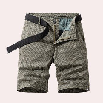 Men's gray khaki herringbone summer shorts in a casual fit, made from breathable cotton, emphasizing a simple yet stylish design suitable for warm weather.