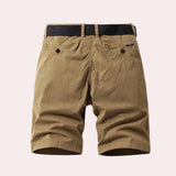 Men's khaki herringbone summer shorts made from breathable cotton, featuring a casual fit and beige color.