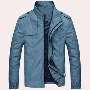 Men's light blue military utility jacket with long sleeves, a collar, and button closure, made from natural, breathable, and water-resistant material.